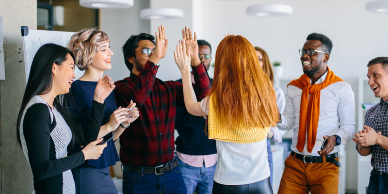 Group of people, give high five to each other