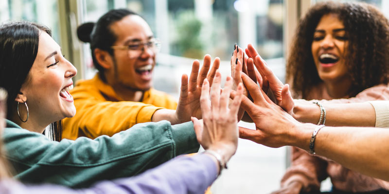 Group of People giving each other a high five